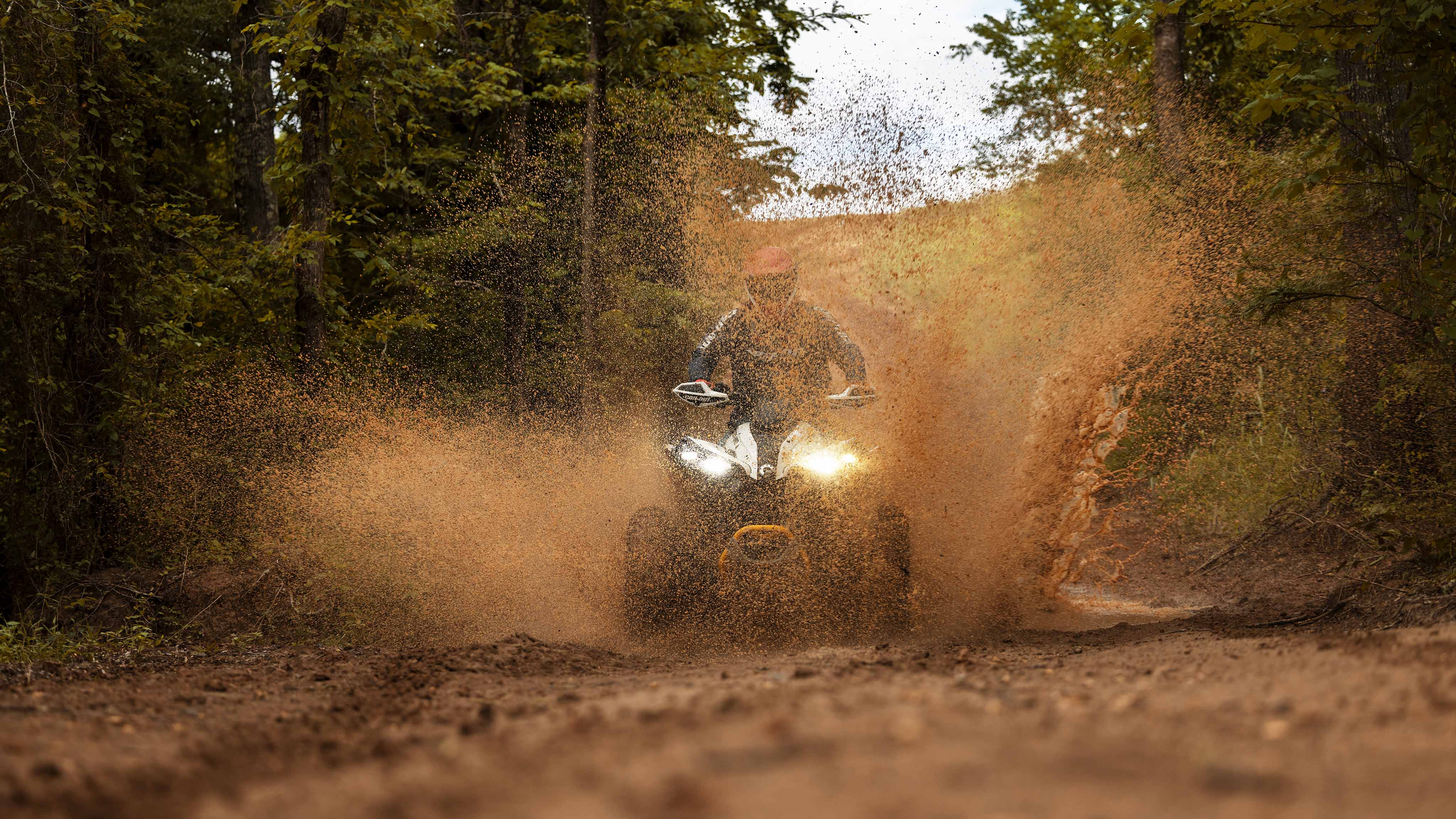 A Can-Am Renegade kicking up mud